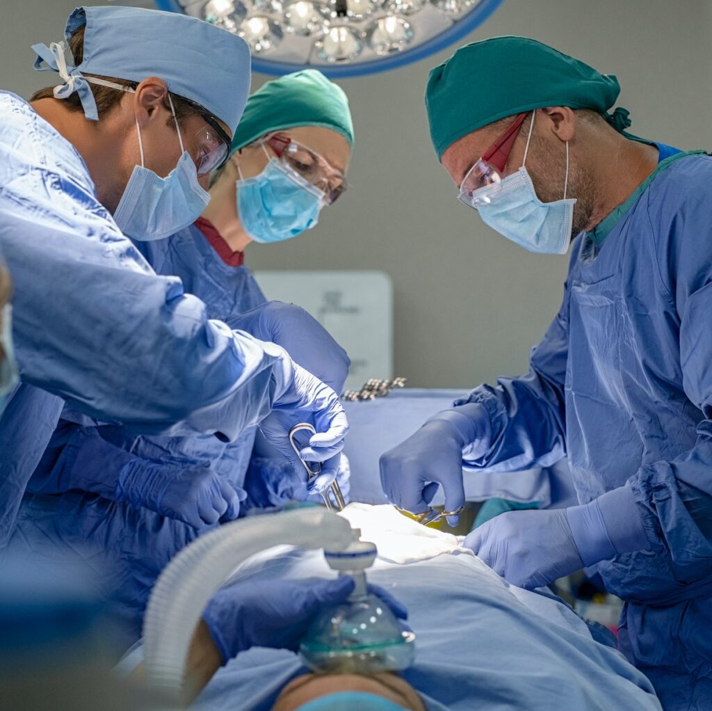 Team of surgeons performing surgery